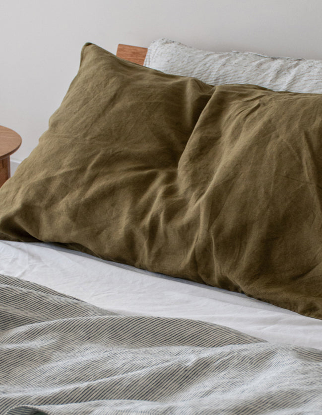 Olive Pillowcases, Pinstripe Flat Sheet and Sage Quilt Cover