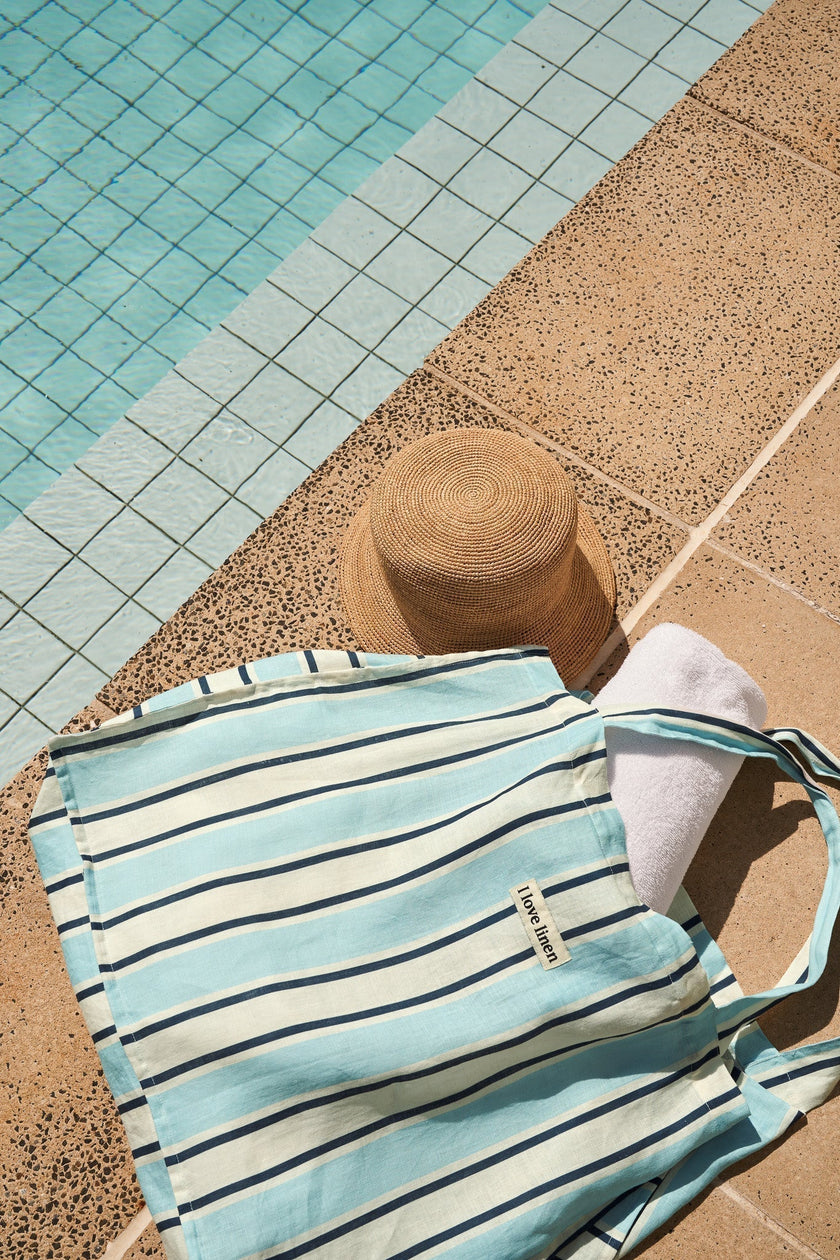 blue stripe linen market bag by the pool 